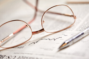 eyeglasses on the newspaper pages