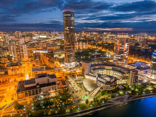 Yekaterinburg city and pond aerial panoramic view at summer or early autumn night. Night city in the early autumn or summer.