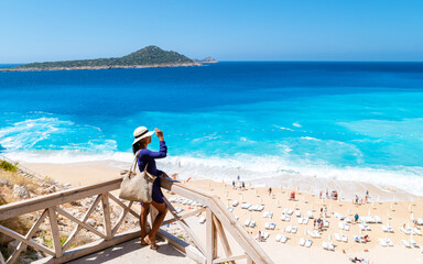 Kaputas beach Lycia coast Turkey Kaputas Beach, young Asian women looking out over the...