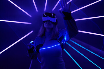 Woman is using virtual reality headset to access in metaverse.