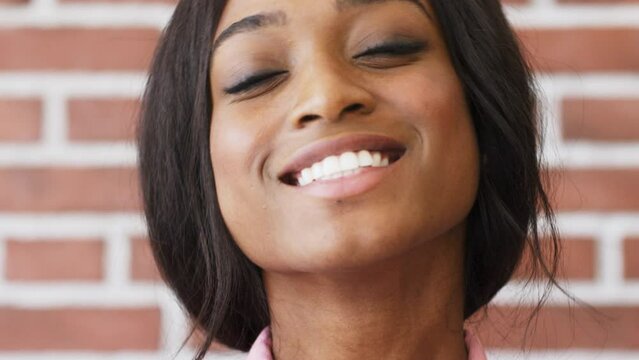 Macro, portrait and smile on face of black woman in home, dental and health. Woman, happy and positive mindset, motivation in house for closeup or zoom, to show skin and healthy teeth in Brazil