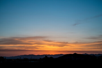 Orange sunless sunrise in summer