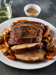 Roasted pork Loin with carrot and broccoli. Grilled sliced Pork Meat