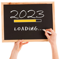 Png of hands golding blackboard with 2023 new year loading sign - 534156754