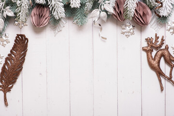 Christmas flat lay composition from pine, cones, balls on wooden background top view. Copy space