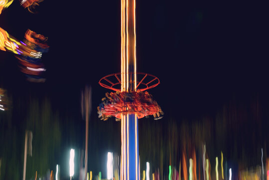 Defocused and motion blurred photo of "Tower elevator" named fun device in the izmir fun fair.