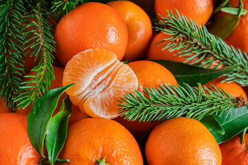 Fresh orange tangerines with leaves, natural background