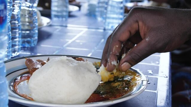Africa Nigeria local popular dishes known as ewedu and eba .