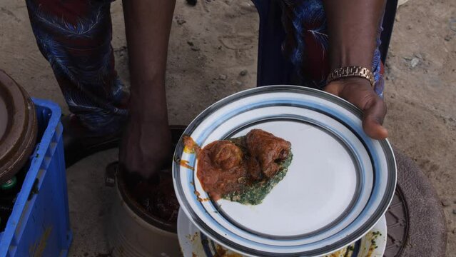 Africa Nigeria local popular dishes known as ewedu and eba .