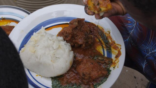 Africa Nigeria local popular dishes known as ewedu and eba .
