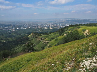 Naklejka premium Panoramic views from Bolshoye Sedlo mountain to the Kislovodsk National Park and the city of Kislovodsk, North Caucasus, Russia.