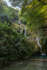 Fototapeta na wymiar Krushunski waterfalls with turqoize waters and beautiful ecosystem