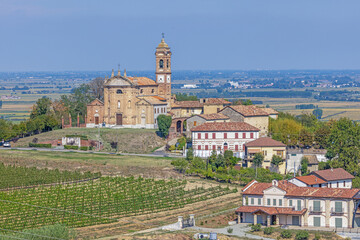 View of the village church of Camino in the Italian province of Piedmont with the Po Valley in the background during the daytime