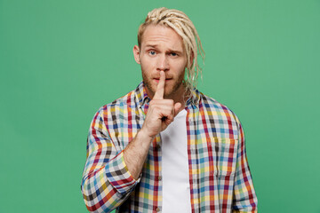 Young secret blond man caucasian with dreadlocks 20s he wear casual shirt say hush be quiet with...