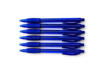 Blue ballpoint pens isolated on white background.
