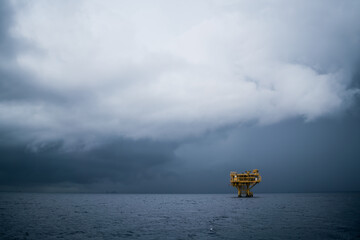 Fototapeta na wymiar Storms are coming on remote offshore oil and gas rigs that produce raw materials for onshore refineries, power generation and petrochemical industries.