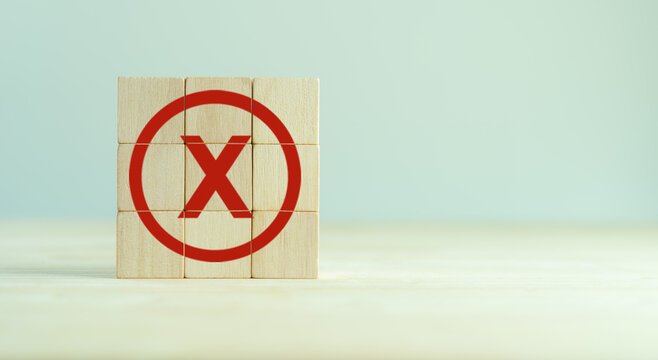 Red Cross Mark, X, Wrong Mark Sign, Rejection Sign In Wooden Cube Stack. Concept Of Negative Decision Making Or Choice Of Vote, Againt, Resist, Contravene The Law, Regulatory, Non-compliance Concept.