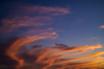 Naklejka na ściany i meble Sunset sky with orange clouds. Nature background.