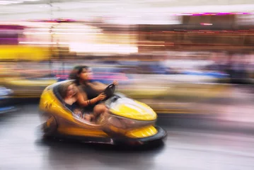 Deurstickers Abstract photo of bumper cars at amusement park of izmir fun fair. © ardasavasciogullari