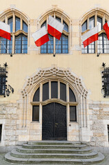 Fototapeta na wymiar Vintage facade and Polish flags