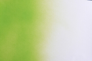 gradient green spray paint on a white paper background