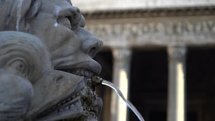 Beautiful view of Pantheon Temple, close up ancient sculpture fountain with latin religious inscription decorating square. Religion and tourism in Rome. High quality 4k footage - Powered by Adobe