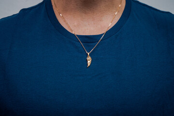 man with necklace model posing pendant silver gold jewellery sweater