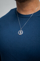 man with necklace model posing pendant silver gold jewellery sweater