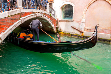 Fototapeta na wymiar Gondolas on the ancient canals of Venice, Italy