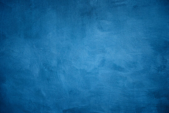 Grunge scratched blue wall texture background.