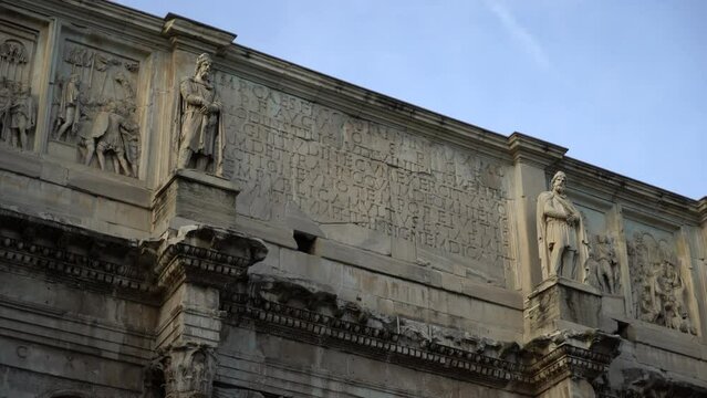 ROME, ITALY. 28.08.2022. close up shot of the Arch of Constantine in front of the Colosseum in Rome. High quality 4k footage