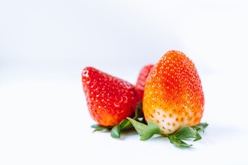 Ripe juicy strawberries on light background