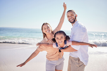 Portrait of a happy family play on beach vacation and having fun together in Cancun. Parent, child...