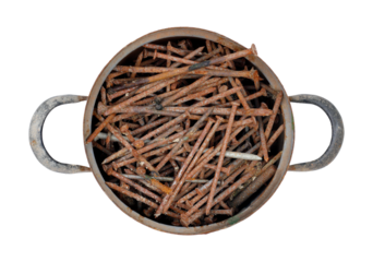 Saucepan full of rusty nails on transparent background