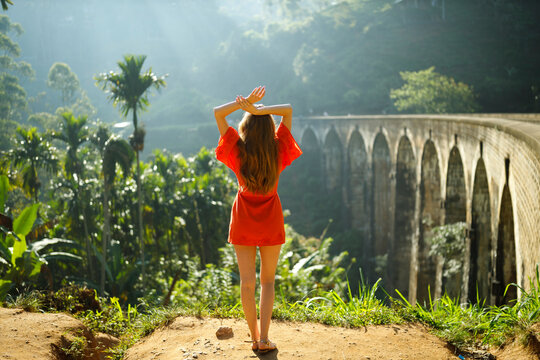 Woman in front of Nine Arch Bridge, Ella, Sri Lanka