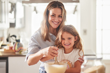 Love, mother and child in kitchen cooking together for parent bonding leisure in New Zealand home. Happy, joyful and caring mom teaching and helping daughter with food preparation skill with whisk.