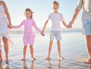 Happy family love, beach and hands of children together with parents while having outdoor fun and enjoy quality time. Young kids, youth or siblings connect, bond and relax on water, sea or ocean sand