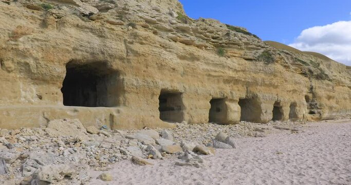 Port Willunga historic beach caves carved out by fisherman to store boats and nets, Left to right pan, Fleurieu Peninsula, South Australia,Australia