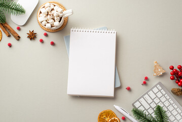 New Year concept. Top view photo of planner keyboard computer mouse mug of cocoa with marshmallow mistletoe fir branches dried orange slices cinnamon sticks on isolated grey background with copyspace
