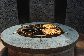 Chicken barbecued on volcanic heat, Timanfaya National Park, Canary Islands, Spain