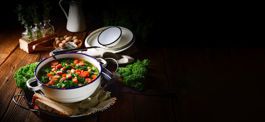 autumnal kale soup with sausage and bacon cubes