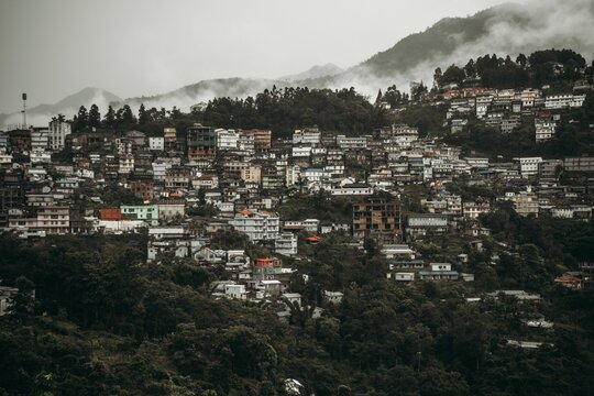 Drone shot of the beautiful cityscape of Kohima on a cloudy day in India