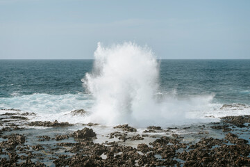 Water splash on black volcanic rocks of Tenesar, Lanzarote, Canary Islands