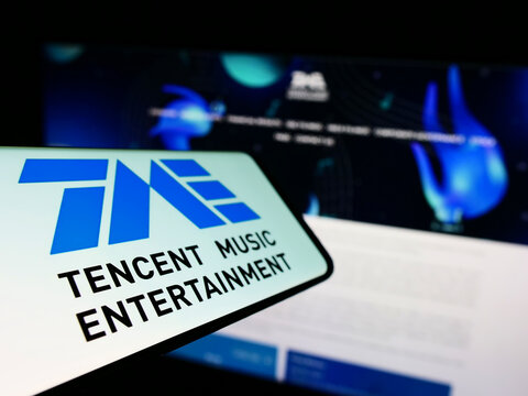 Stuttgart, Germany - 09-25-2022: Smartphone with logo of Chinese company Tencent Music Entertainment Group on screen in front of business website. Focus on left of phone display.