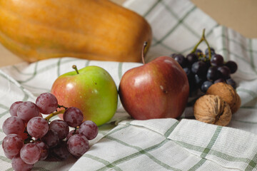 Autumn fruits, nuts and pumpkin.Thanksgiving background. Autumn concept with copy space.