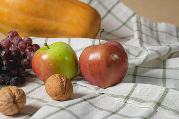 Autumn fruits, nuts and pumpkin.Thanksgiving background. Autumn concept with copy space.
