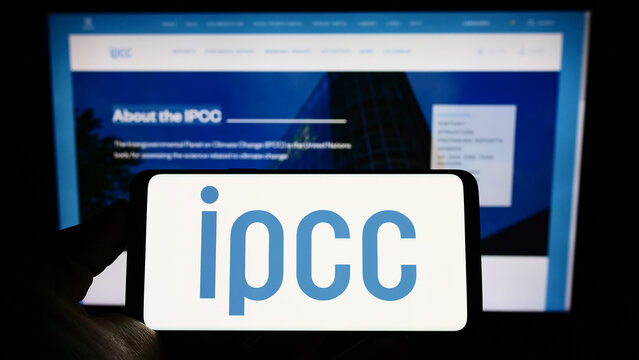 Stuttgart, Germany - 09-25-2022: Person holding mobile phone with logo of Intergovernmental Panel on Climate Change (IPCC) on screen in front of web page. Focus on phone display.