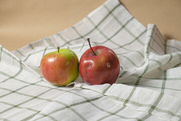 Two apples on a white towel background