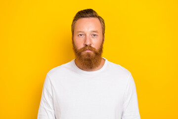 Obraz premium Closeup photo of young confident handsome gentleman guy redhair beard concentrated look you isolated on yellow color background