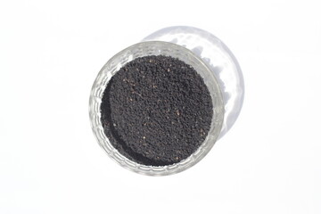 Black cumin seeds on a white background, black cumin seeds on a bowl
